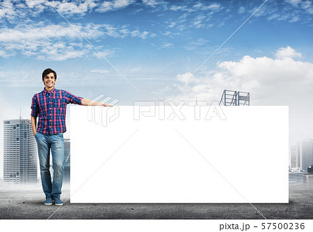 Guy in casual with placard 57500236