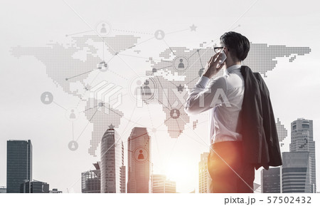 Concept of business success and control with confident boss against cityscape background Concept of business success and control with confident boss against cityscape background 57502432