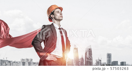 Concept of power and sucess with architect superhero in big city Concept of power and sucess with architect superhero in big city 57503263