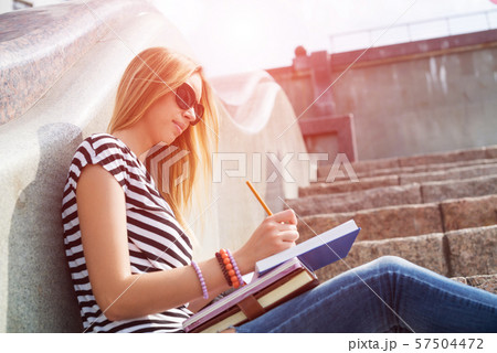 Student girl at staircase 57504472