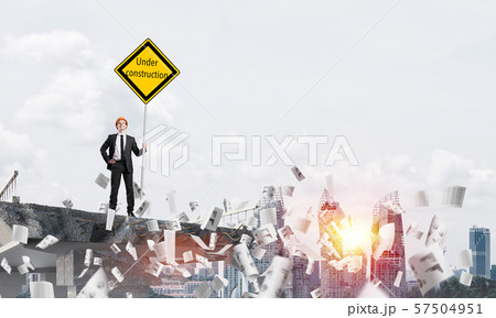 Confident engineer holding street safety sign. Confident engineer holding street safety sign. 57504951