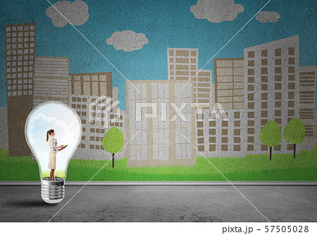 Businesswoman trapped in bulb 57505028
