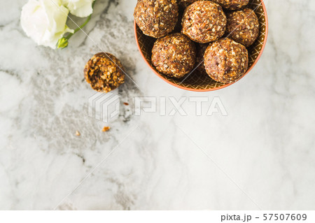Energy balls with healthy ingredients on marble Energy balls with healthy ingredients on marble 57507609