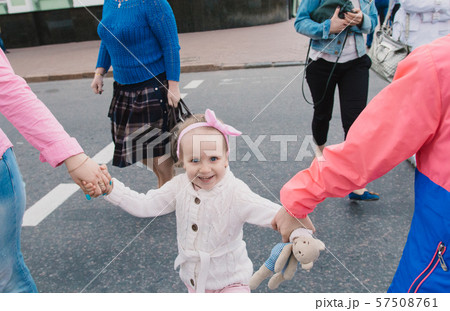 Happy mother and her children are walking around Happy mother and her children are walking around 57508761