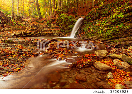 Autumn mountain waterfall 57508923