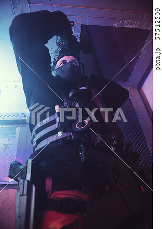 Special unit soldier is putting gas mask Special unit soldier is putting gas mask 57512509