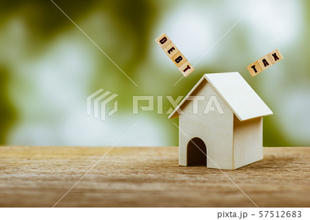 Home taxes and debt concept. A small house model 57512683