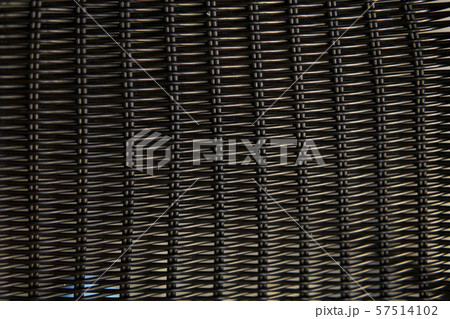 Brown rattan pattern texture on a chair. 57514102