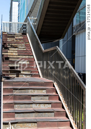 Damaged staircase. Old staircase in the metropolis. Broken stairs on a flight of stairs Damaged staircase. Old staircase in the metropolis. Broken stairs on a flight of stairs 57514168