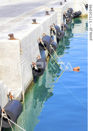 Bollards and mooring wing on a sea pier. 57516946