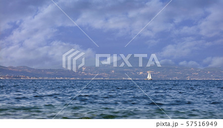 The silhouette of a sailing yacht on the horizon 57516949