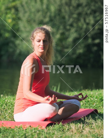 Woman Doing Yoga in the Park Woman Doing Yoga in the Park 57516967