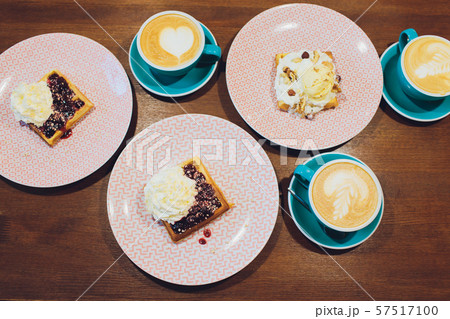 Whole wheat waffles with ice cream, maple syrup and coffee. Wooden background. Close up. 57517100