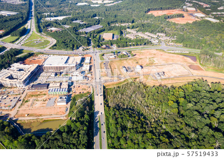 Aerial view new Mall construction in Atlanta suburbs next to highway Aerial view new Mall construction in Atlanta suburbs next to highway 57519433