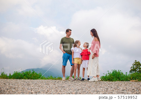 Beautiful happy family in mountains in the background of fog 57519952