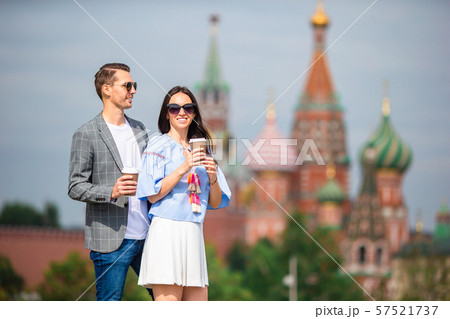 Young dating couple in love walking in city background St Basils Church 57521737