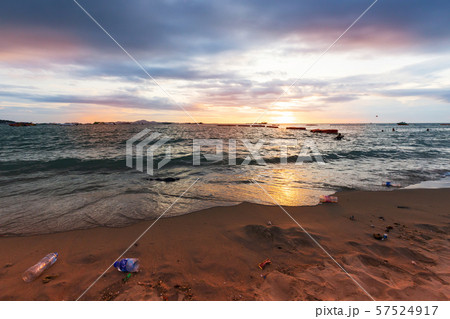 Garbage on the beach in sunset light 57524917