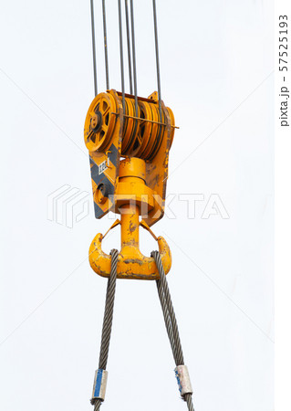 the pulley and hook of a tower cranes against a the pulley and hook of a tower cranes against a 57525193