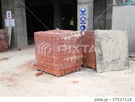 Clay bricks stock pallets stacking at the construction site. Clay bricks stock pallets stacking at the construction site. 57527118