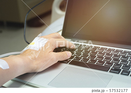 Hand of patient using laptop while recovery in hospital ward 57532177