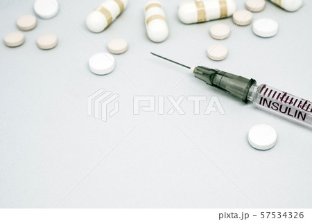 Insulin syringe, injection needle and some tablets Insulin syringe, injection needle and some tablets 57534326