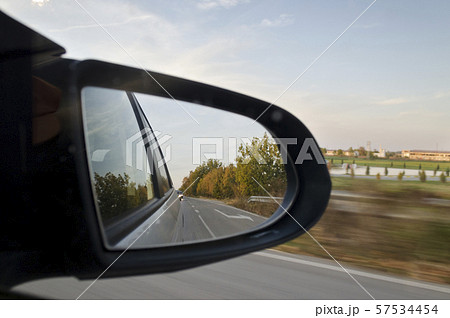 Looking in the side rear-view mirror during the Looking in the side rear-view mirror during the 57534454