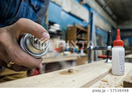 Furniture fittings and wooden dowels. Carpenter spray on dowel Furniture fittings and wooden dowels. Carpenter spray on dowel 57536498