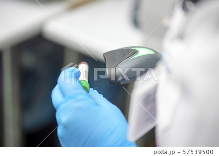 Bar code scanner and test tube over monitor Bar code scanner and test tube over monitor 57539500