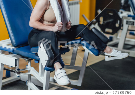Beautiful sport girl is engaged on a simulator in the gym. Pretty girl with the beautiful tightened Beautiful sport girl is engaged on a simulator in the gym. Pretty girl with the beautiful tightened 57539760