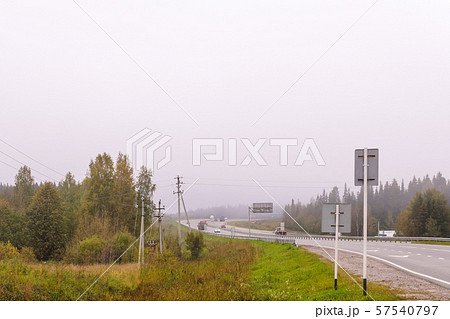 highway in autumn foggy terrain 57540797