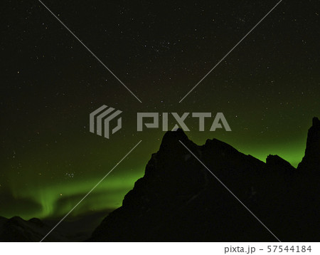 Mountains with northern lights in the background Mountains with northern lights in the background 57544184
