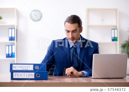 Young male accountant working in the office 57548372