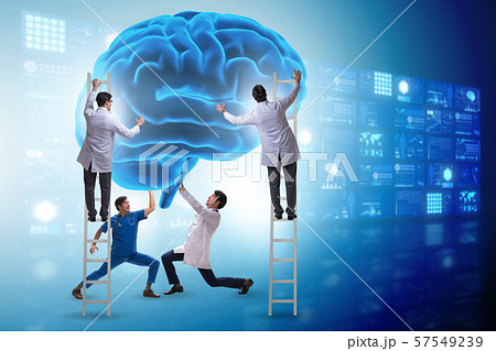 Team of doctors examining human brain Team of doctors examining human brain 57549239