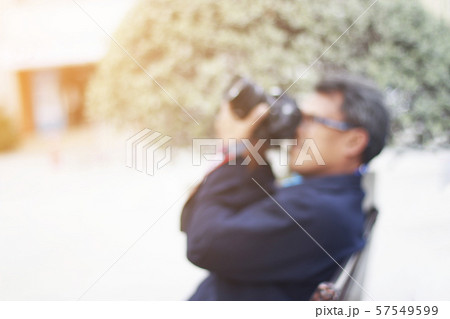 Blur of man take a photo and copy space and orange Blur of man take a photo and copy space and orange 57549599