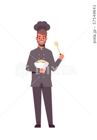 male professional chef cook holding plate and spoon man restaurant worker in uniform tasting dish 57549641