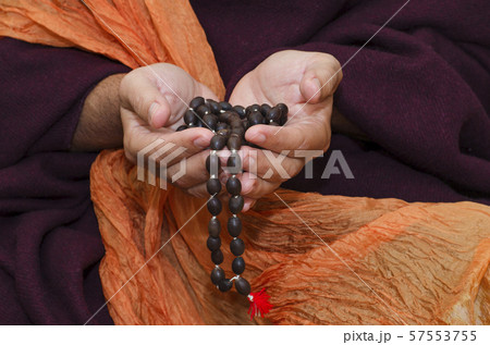 Buddhist Monk with mala beads 57553755