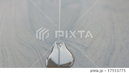 pour oil onto black walnut board 57553775