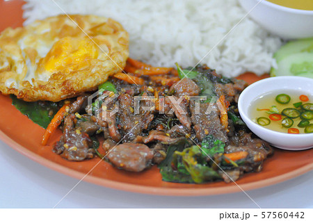 stir-fried beef with fried egg, holy basil and 57560442