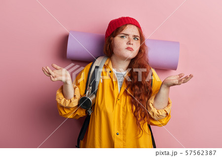 frustrated tired woman doesn't know the direction 57562387