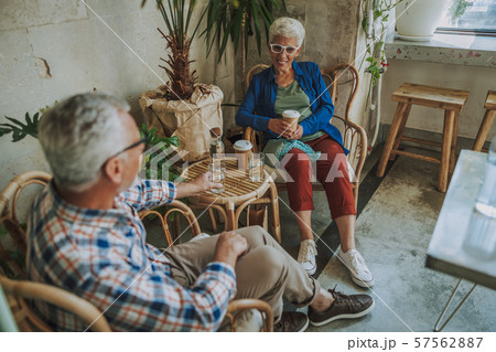 Meeting old friend in small cafe stock photo 57562887