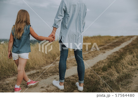 Young mother and liitle kid is looking away 57564480