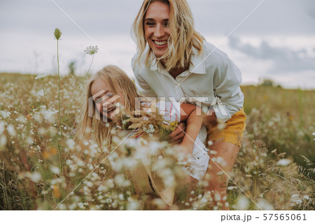 Happy woman having fun with her daughter 57565061