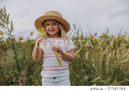 Caucasian smiling kid having rest near the field Caucasian smiling kid having rest near the field 57565368