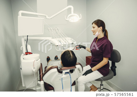 Beautiful girl in a dentist 57565561