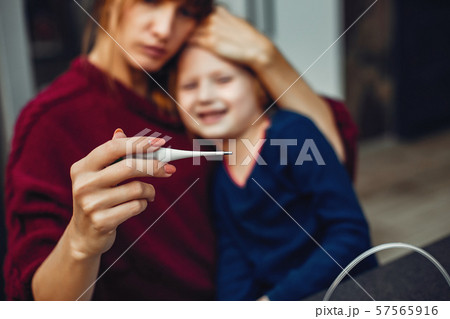 Mother treats her daughter at home 57565916