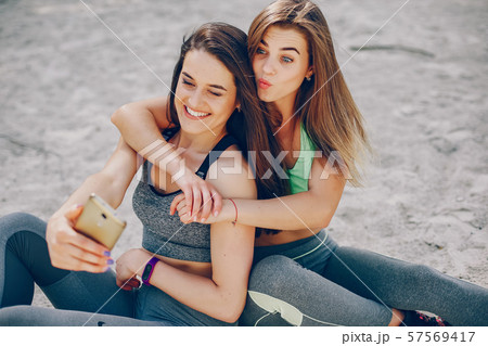 Two girls on a beach 57569417
