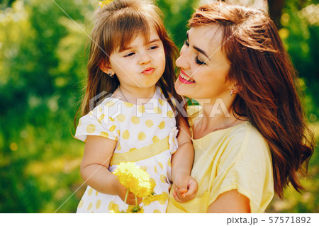 mother with daughter in a solar park 57571892