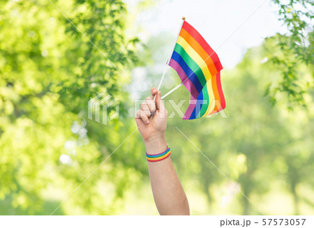 hand with gay pride rainbow flags and wristband hand with gay pride rainbow flags and wristband 57573057