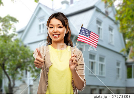 happy asian woman with american flag happy asian woman with american flag 57573803