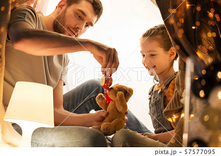 happy family playing with toy in kids tent at home 57577095